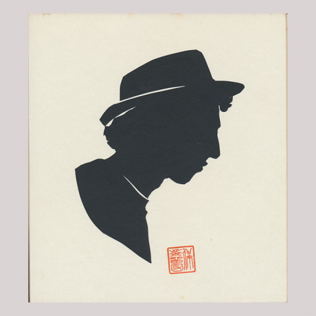 
        Front of silhouette, with man looking right, wearing a hat.